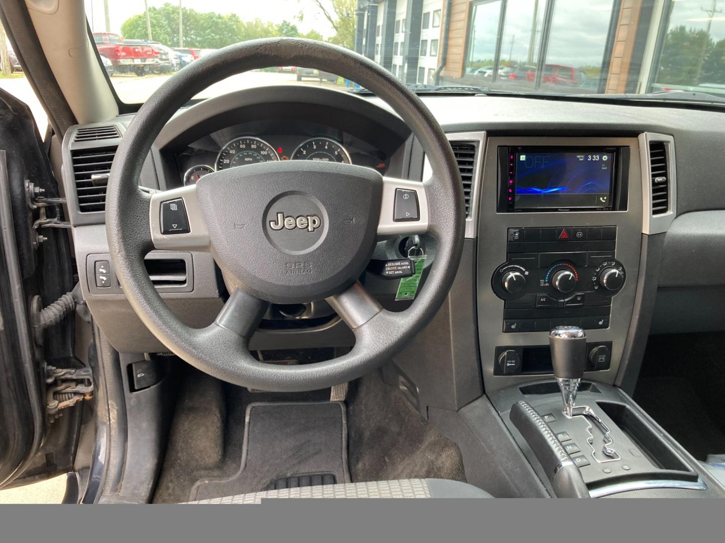 2010 Black Met Jeep Grand Cherokee Laredo 4WD (1J4PR4GK6AC) with an 3.7L V6 SOHC 12V engine, 5-Speed Automatic transmission, located at 1800 South Ihm Blvd, Freeport, IL, 61032, (815) 232-5543, 42.278645, -89.607994 - Photo#5